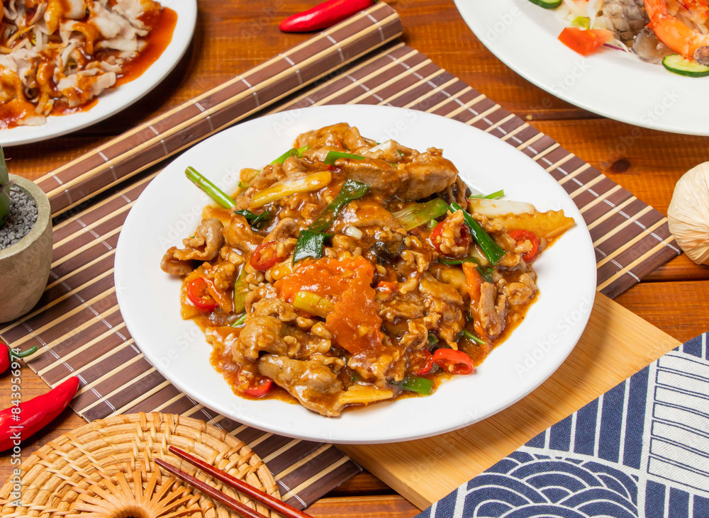 Taiwan Hollow Lamb with chopsticks served in dish isolated on table side view taiwanese food Taiwan Hollow Lamb with chopsticks served in dish isolated on table side view taiwanese food