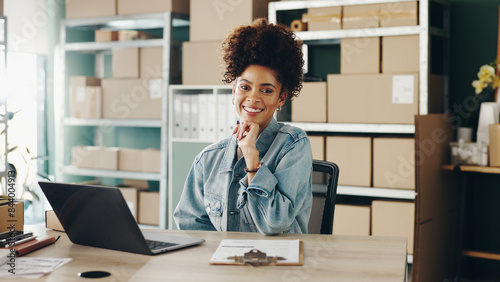 Portrait, business and woman with laptop, boxes and startup with online order, logistics and inventory. Face, person and entrepreneur with stock, computer and company website with parcel and package photo