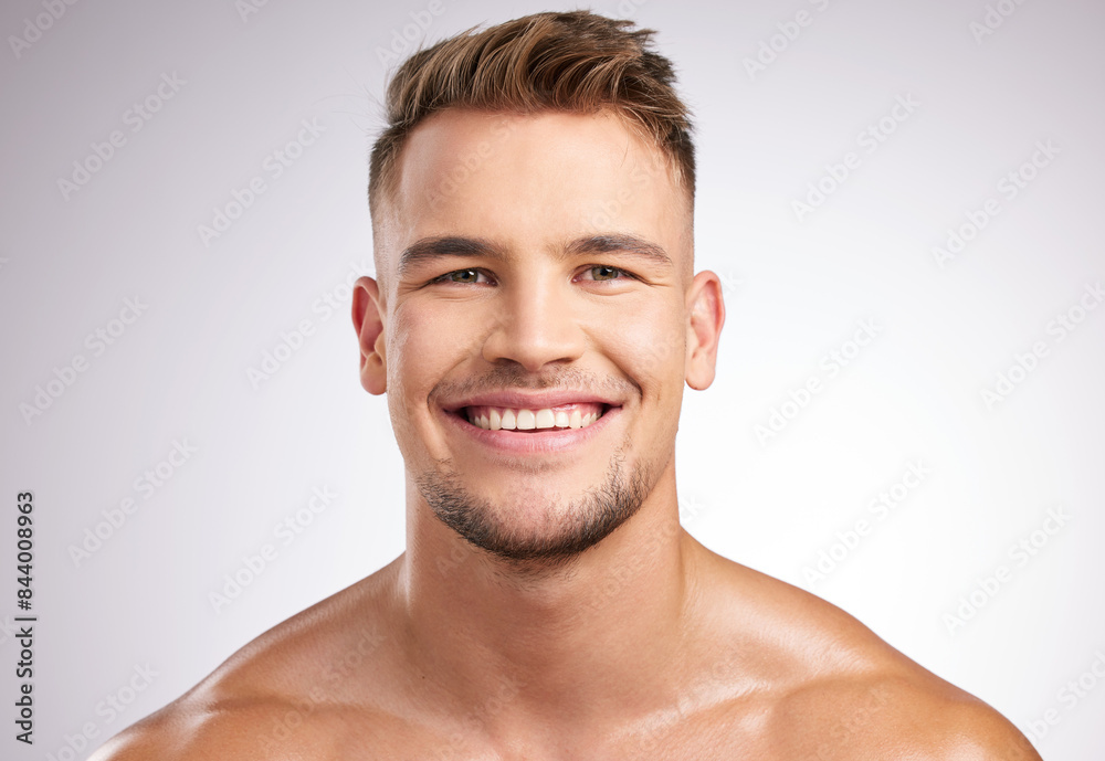 Man, portrait and happy in studio for skincare, smile and grey background for cosmetology or body care. Dermatology, face cleaning and beauty or wellness, hygiene and grooming with male person Man, portrait and happy in studio for skincare, smile and grey background for cosmetology or body care. Dermatology, face cleaning and beauty or wellness, hygiene and grooming with male person