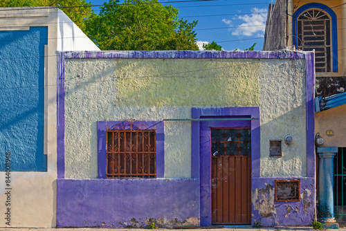 Small colonial style  colordul buildings at street of Merida city old town, Mexico photo