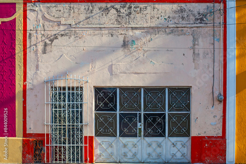 Small colonial style  colordul buildings at street of Merida city old town, Mexico photo