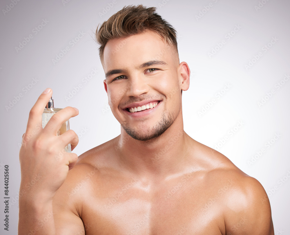 Man, portrait and cologne in studio for health, cleaning and wellness or body care. Male person, skincare and hygiene in bathroom for cosmetics, perfume and antiperspirant by white background Man, portrait and cologne in studio for health, cleaning and wellness or body care. Male person, skincare and hygiene in bathroom for cosmetics, perfume and antiperspirant by white background