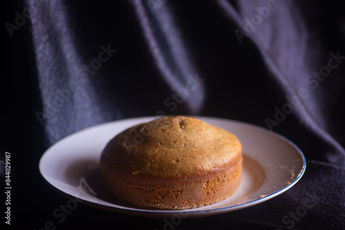 Freshly baked cake on a plate in a bakery