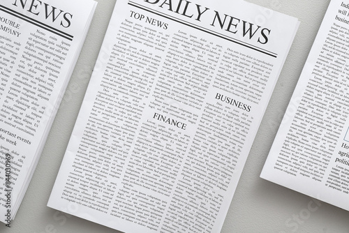 Newspapers against white ba...