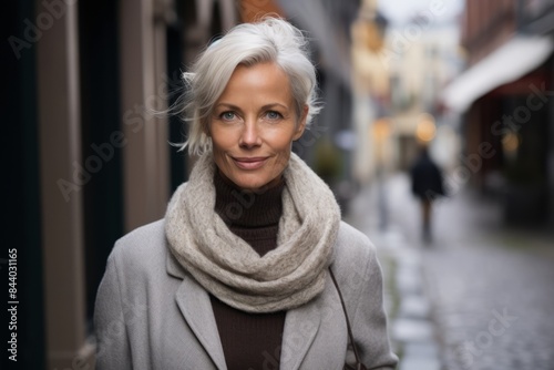 Portrait of a middle-aged woman in a city street. © Stocknterias