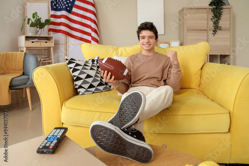 Teenage boy with rugby ball...