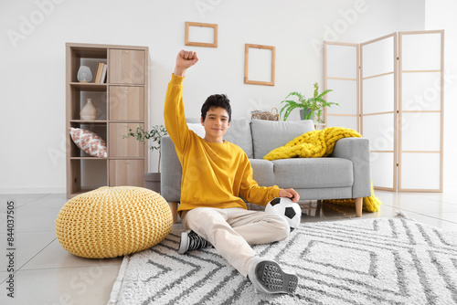 Cheerful teenage boy with s...