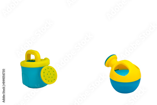 Children's toys for playing in sand. Two watering cans for sandbox without background. For text