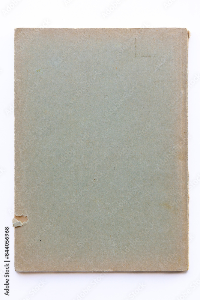 Destroyed cardboard cover of a very old book. yellowed natural paper texture. isolated on white background. clean close-up. Destroyed cardboard cover of a very old book. yellowed natural paper texture. isolated on white background. clean close-up.
