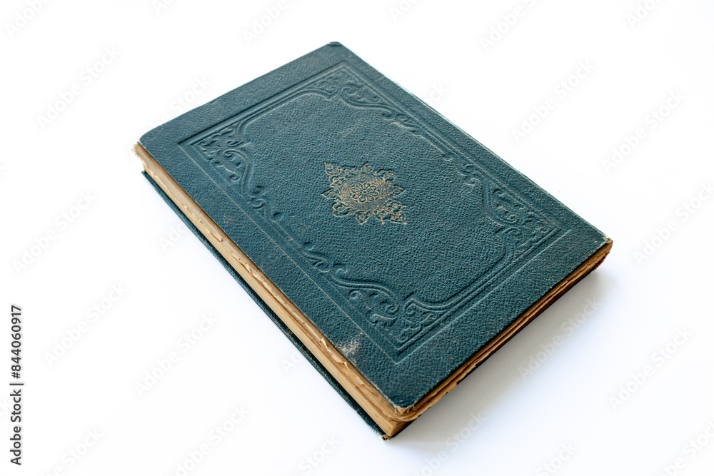 green coloured damaged cover of a very old book. yellowed natural paper texture. isolated on white background. clean close-up. green coloured damaged cover of a very old book. yellowed natural paper texture. isolated on white background. clean close-up.