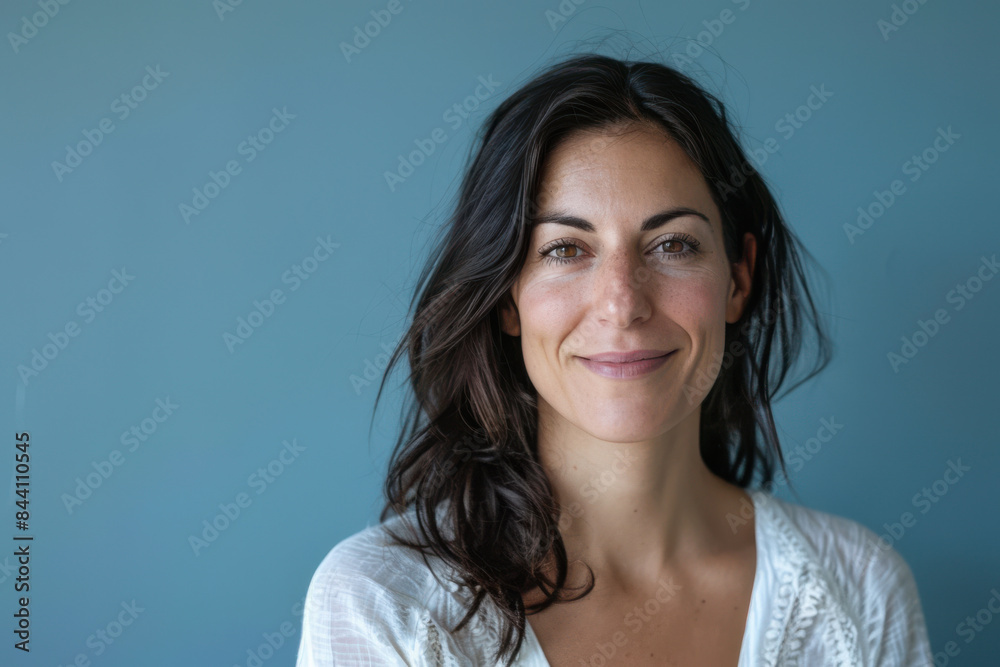 A close up portrait of a young woman with a subtle smile A close up portrait of a young woman with a subtle smile