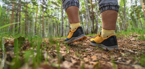 Walk in sport shoes in the forest 