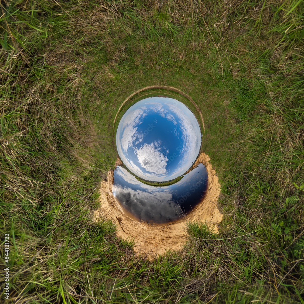 blue hole sphere or globe little planet inside sand or dry grass round frame background blue hole sphere or globe little planet inside sand or dry grass round frame background