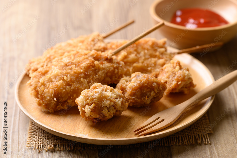 Deep fried chicken breast with stick, Thai street food Deep fried chicken breast with stick, Thai street food