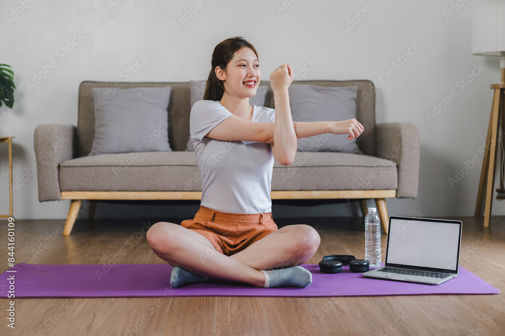 Asian young woman doing yoga stretching exercise on mat yoga, fitness exercises. Healthy lifestyle Calmness and relax at home. Asian young woman doing yoga stretching exercise on mat yoga, fitness exercises. Healthy lifestyle Calmness and relax at home.