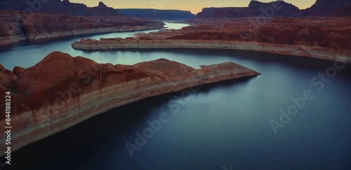 Drone footage of the limestone mountains near Lake Powell reservoir at sunset in Utah, United States,Natural landscape view. photo