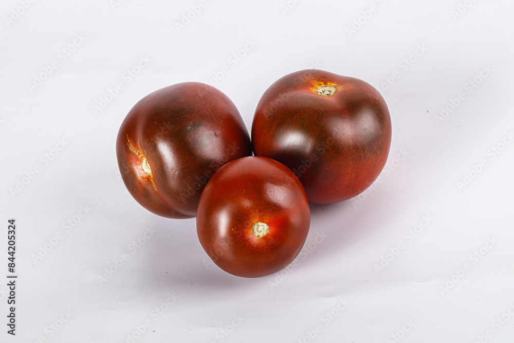 Organic natural juicy Kumato tomato Organic natural juicy Kumato tomato