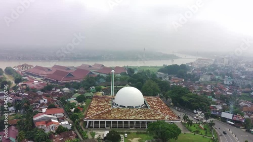 view of densely populated housing and mosques in Jambi, Sumatra island