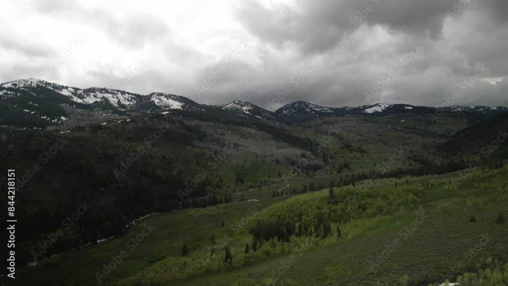 Aerial of Bear River Range mountains in northern Utah in spring with stormy sky near Logan Canyon Aerial of Bear River Range mountains in northern Utah in spring with stormy sky near Logan Canyon