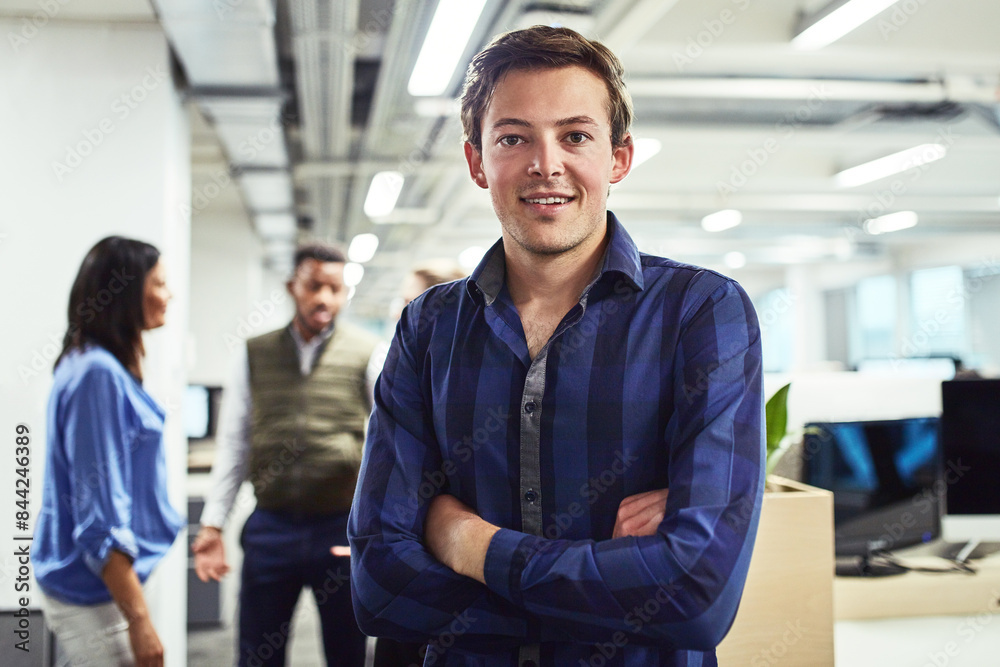 Intern, man and portrait in office with arms crossed, smile and employee with confidence. Business, job and startup with positivity in workplace with trainee, team or apprentice for development Intern, man and portrait in office with arms crossed, smile and employee with confidence. Business, job and startup with positivity in workplace with trainee, team or apprentice for development