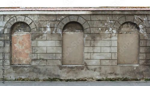 Billede på lærred Ancient ruined cement wall with arched niches isolated