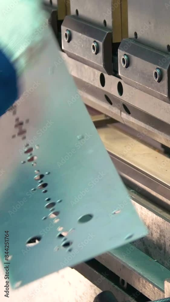 Factory hydraulic press. Stamping of sheet steel parts on a hydraulic press. Stamping on the press. Vertical video. Factory hydraulic press. Stamping of sheet steel parts on a hydraulic press. Stamping on the press. Vertical video.