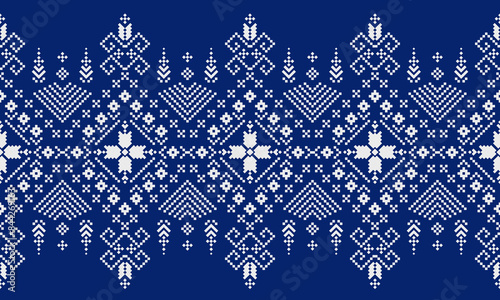a detailed fabric pattern composed of pixelated designs and blue background