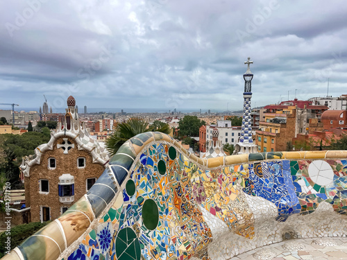 Mosaic bench in Gaudi's Park Guell in Barcelona, Spain on cloudy day. photo