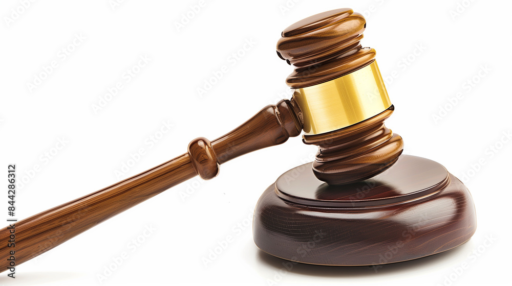 A balance scale and gavel on top of books, representing the law in an office setting with a blurred background. A balance scale and gavel on top of books, representing the law in an office setting with a blurred background.