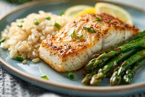 A clean, realistic photo of a low-sodium recipe with steamed asparagus, brown rice, and baked fish. Focus on the simple, heart-healthy ingredients and their fresh, natural appearance