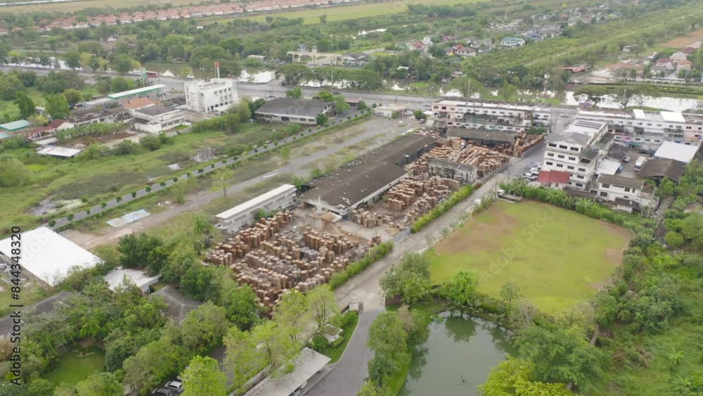 Aerial top view of wood industry factory in urban city town. Business distribution logistic transport in Thailand. Aerial top view of wood industry factory in urban city town. Business distribution logistic transport in Thailand.