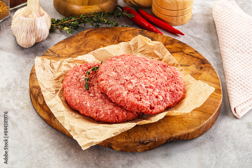 Фотография Raw beef minced meat cutlet