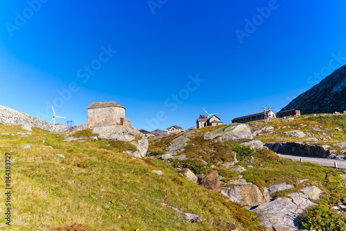 Scenic view of summit at Swiss mountain pass Gotthard with buildings and stone chapel on a sunny late summer day. Photo taken September 10th, 2023, Gotthard, Canton Ticino, Switzerland.