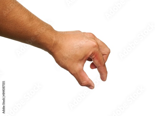 A man's hand Pretend to hold a coin in your hand. And I'm about to put a coin into something. Isolated on white background. business idea.