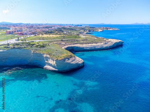 Aerial view of Porto Torres rocky shore on a sunny day