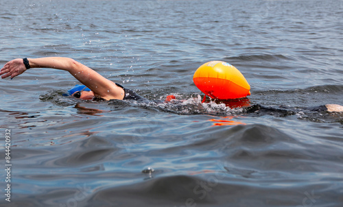 Close up of a women swimming in a bay photo