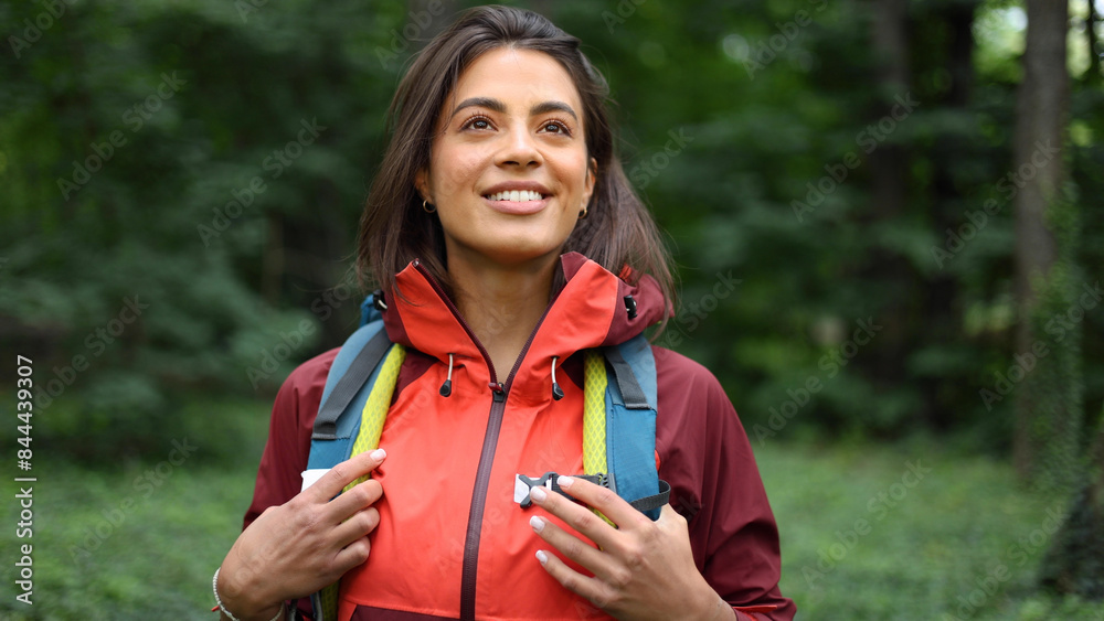 Beautiful, young woman hiking and enjoying in the nature