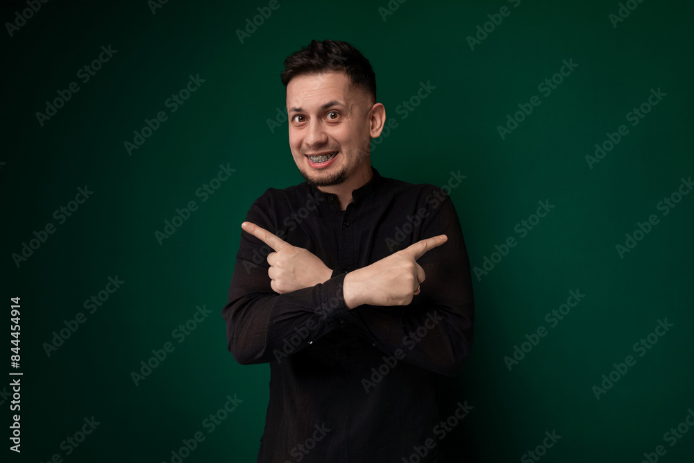 Man in Black Shirt Pointing at Something Man in Black Shirt Pointing at Something