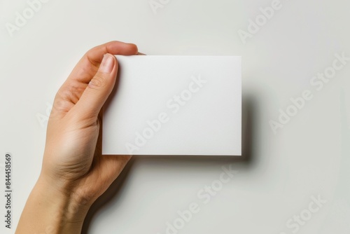 Blank White Card Mockup on Hand created with Generative AI