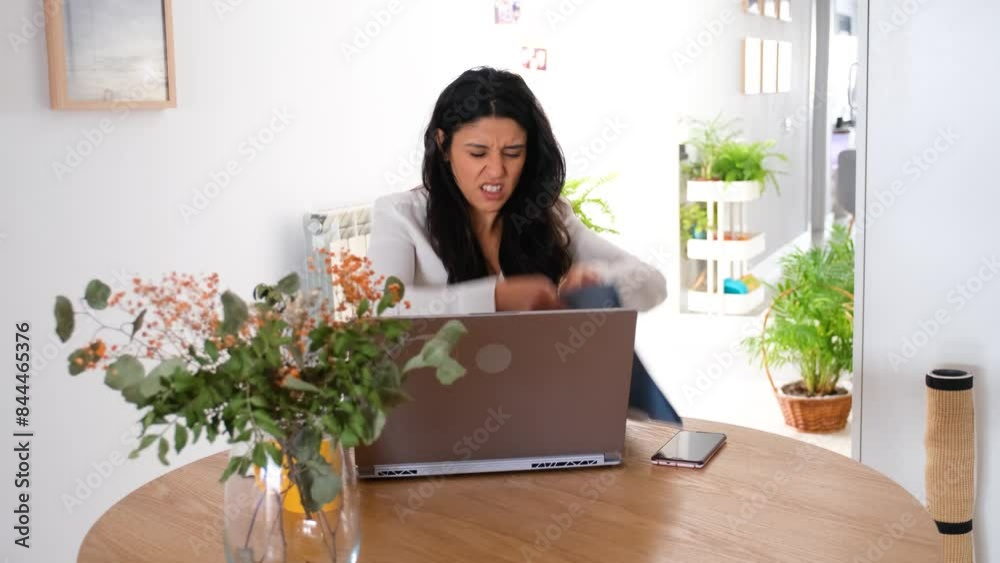 Angry woman is very frustrated with her work and she throw away the documents in her office at home Angry woman is very frustrated with her work and she throw away the documents in her office at home