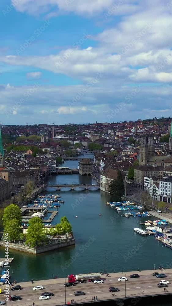 Zurich City Old Town Skyline and Limmat River on Sunny Day. Switzerland. Aerial View. Orbiting. Vertical Video