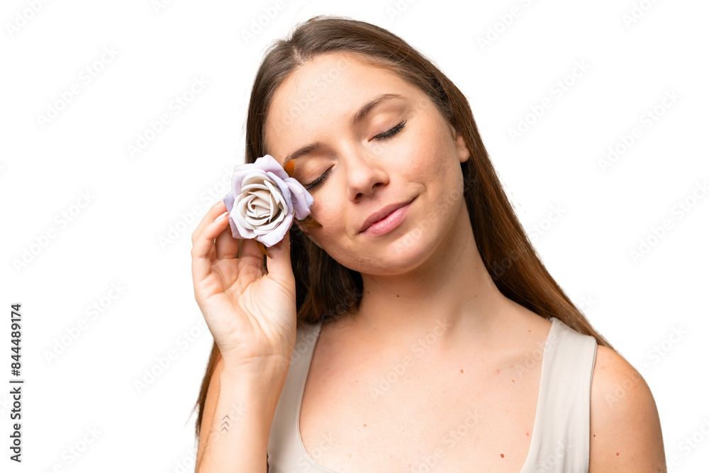 Young blonde woman over isolated chroma key background holding flowers. Close up portrait Young blonde woman over isolated chroma key background holding flowers. Close up portrait