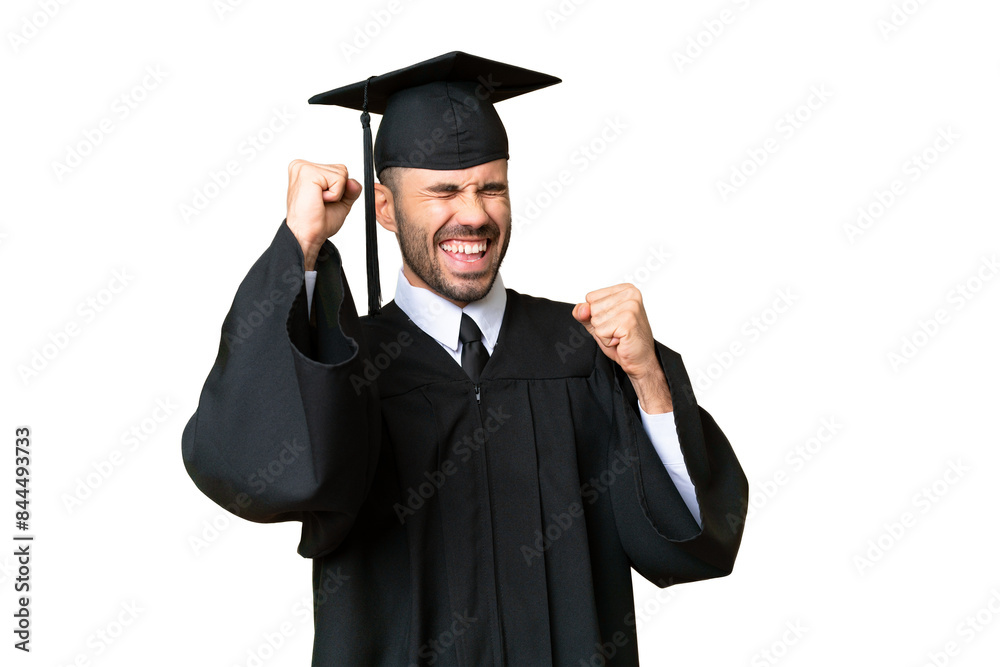 Young university graduate man over isolated chroma key background celebrating a victory Young university graduate man over isolated chroma key background celebrating a victory