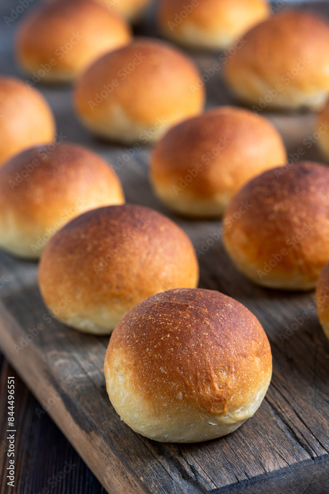 Freshly baked buns with a golden crust. Freshly baked buns with a golden crust.