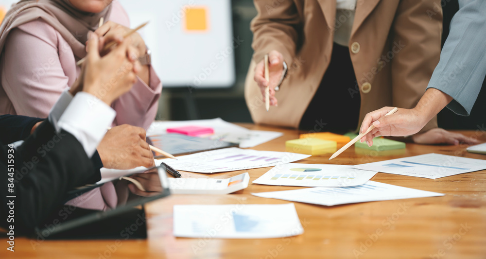 Young colleagues discuss business and analytical price charts, calculate financial, tax, accounting, statistics and analytical research ideas. Young colleagues discuss business and analytical price charts, calculate financial, tax, accounting, statistics and analytical research ideas.