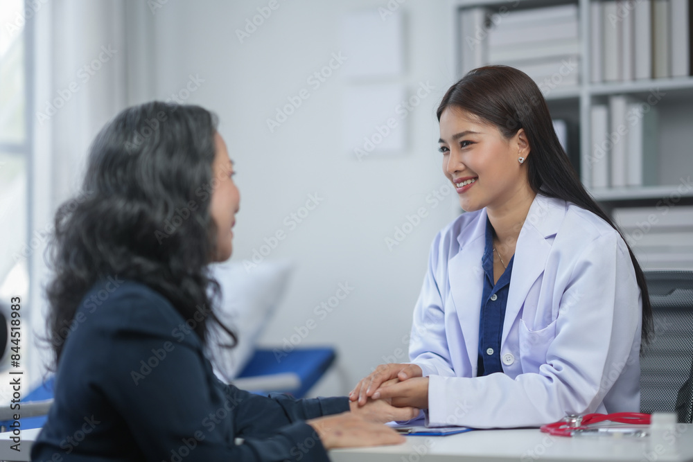 Friendly doctor consults with patient in modern office, offering professional medical advice with a comforting and reassuring smile. Friendly doctor consults with patient in modern office, offering professional medical advice with a comforting and reassuring smile.