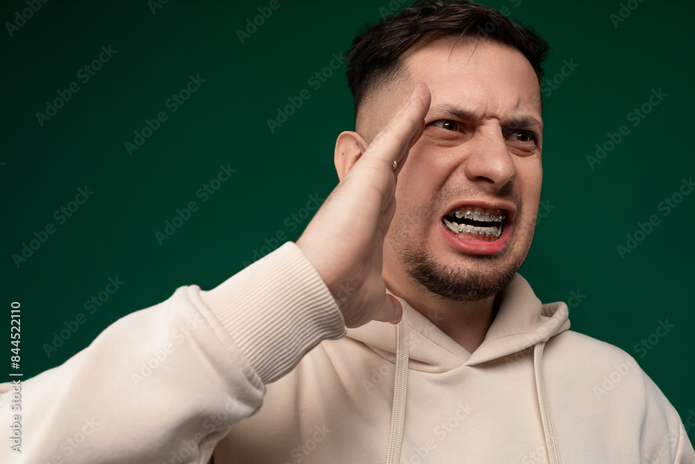 Man Holding Hand Up to Face Man Holding Hand Up to Face