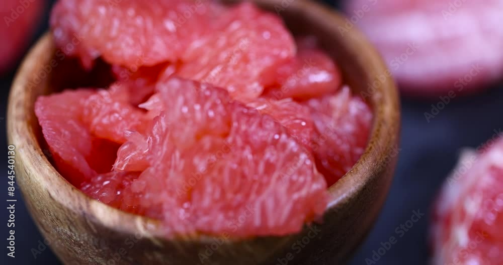 peeled red grapefruit on the table, slices of peeled grapefruit close-up peeled red grapefruit on the table, slices of peeled grapefruit close-up