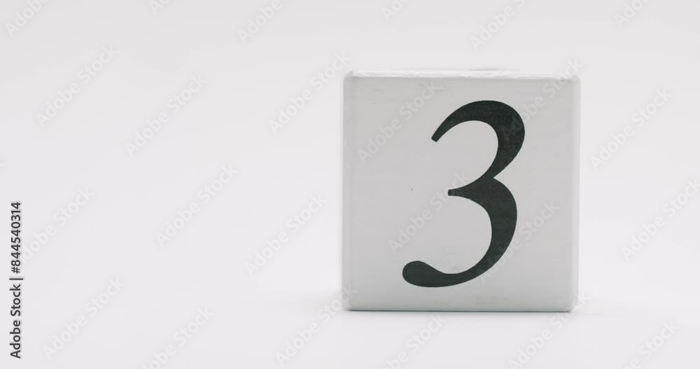Simple white wooden block with the number nine printed in black. Isolated on a white background. White Wooden Block With Number Nine Isolated On White Background Simple white wooden block with the number nine printed in black. Isolated on a white background. White Wooden Block With Number Nine Isolated On White Background