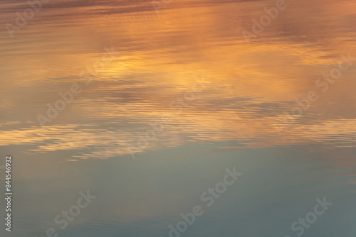 reflection of sunset and dawn in the river, orange and blue sunset colors